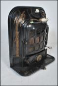 An early 20th Century antique La Salamandre stove having gilt reed decoration with a paneled glass