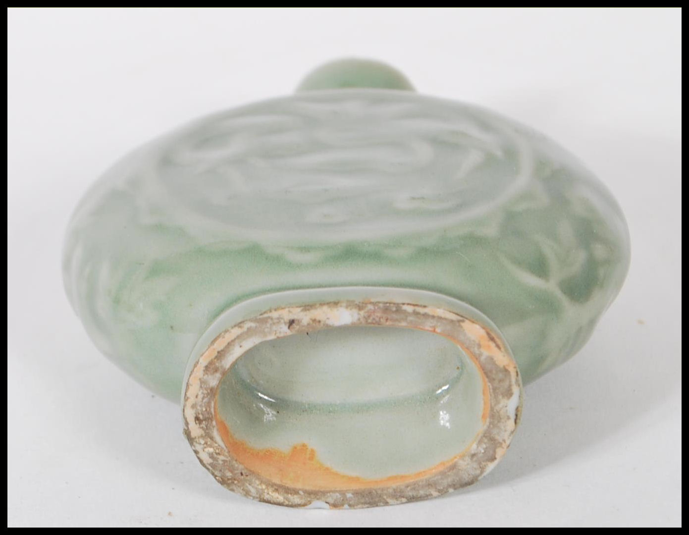 A 19th Century Chinese ceramic bottle / moon flask having a green glaze finish with floral relief - Image 7 of 7