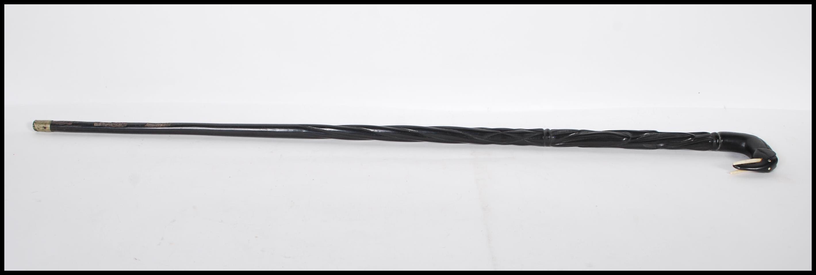 A vintage 20th Century ebony walking stick cane. The handle in the form of an elephant with carved - Image 4 of 6