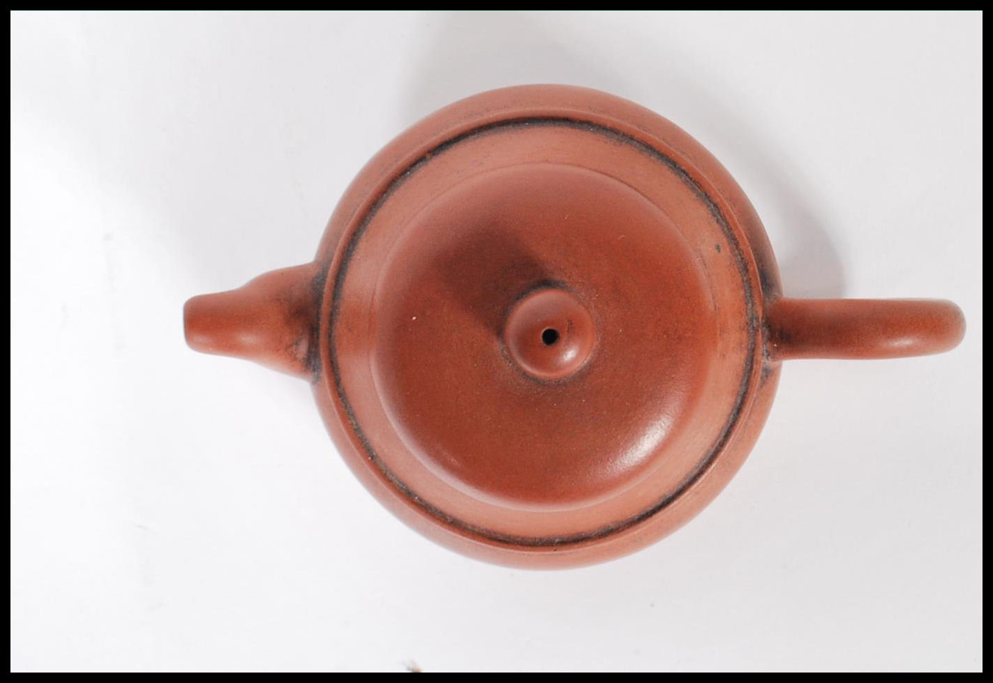 An early 20th Century Chinese Yixing teapot modelled in a brown clay with shaped handle and spout. - Image 5 of 7