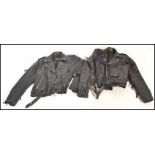 Two leather jackets both having tassels to the arms and backs with one having tassels to the