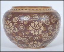 A 19th century Victorian Doulton Lambeth planter pot of bulbous form having two tone floral and gilt