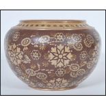 A 19th century Victorian Doulton Lambeth planter pot of bulbous form having two tone floral and gilt