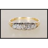 A stamped 18ct yellow gold ring set with five diamonds of approx 90pts. Ring size T. Gross weight