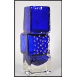 A vintage retro blue glass drunken bricklayers vase in the manner of Geoffrey Baxter for Whitefriars