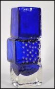 A vintage retro blue glass drunken bricklayers vase in the manner of Geoffrey Baxter for Whitefriars