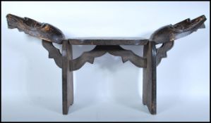A vintage African carved tribal stool, the seat pa