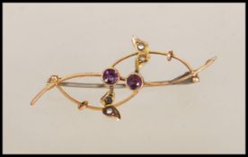 A 9ct gold Victorian brooch with wire work roundle