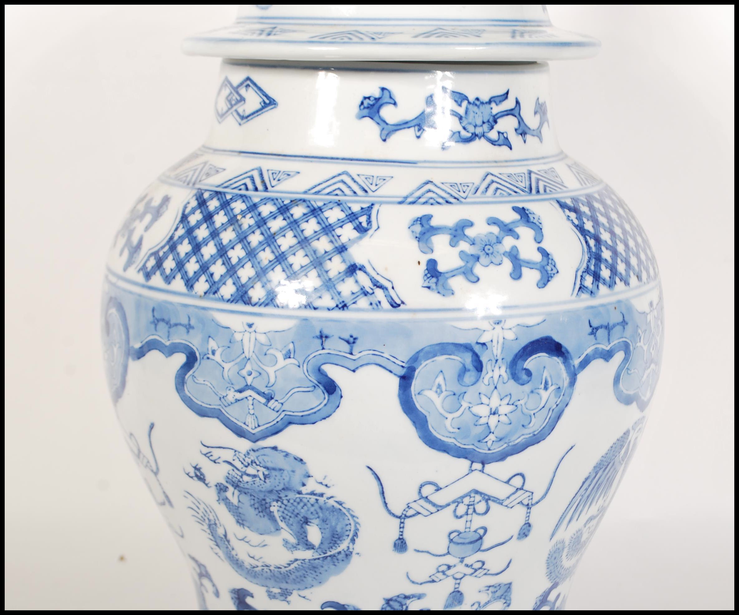 A tall 20th Century Chinese blue and white lidded - Image 5 of 9