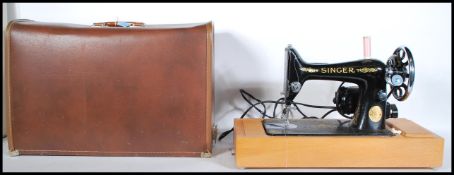 A mid 20th Century vintage cased electric Singer s