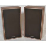 A pair of vintage retro 20th Century teak wood cas