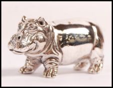 A stamped sterling silver figurine of a hippopotam