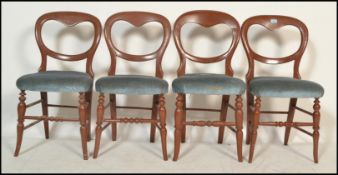 A set of 4 Victorian mahogany balloon back dining