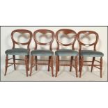 A set of 4 Victorian mahogany balloon back dining