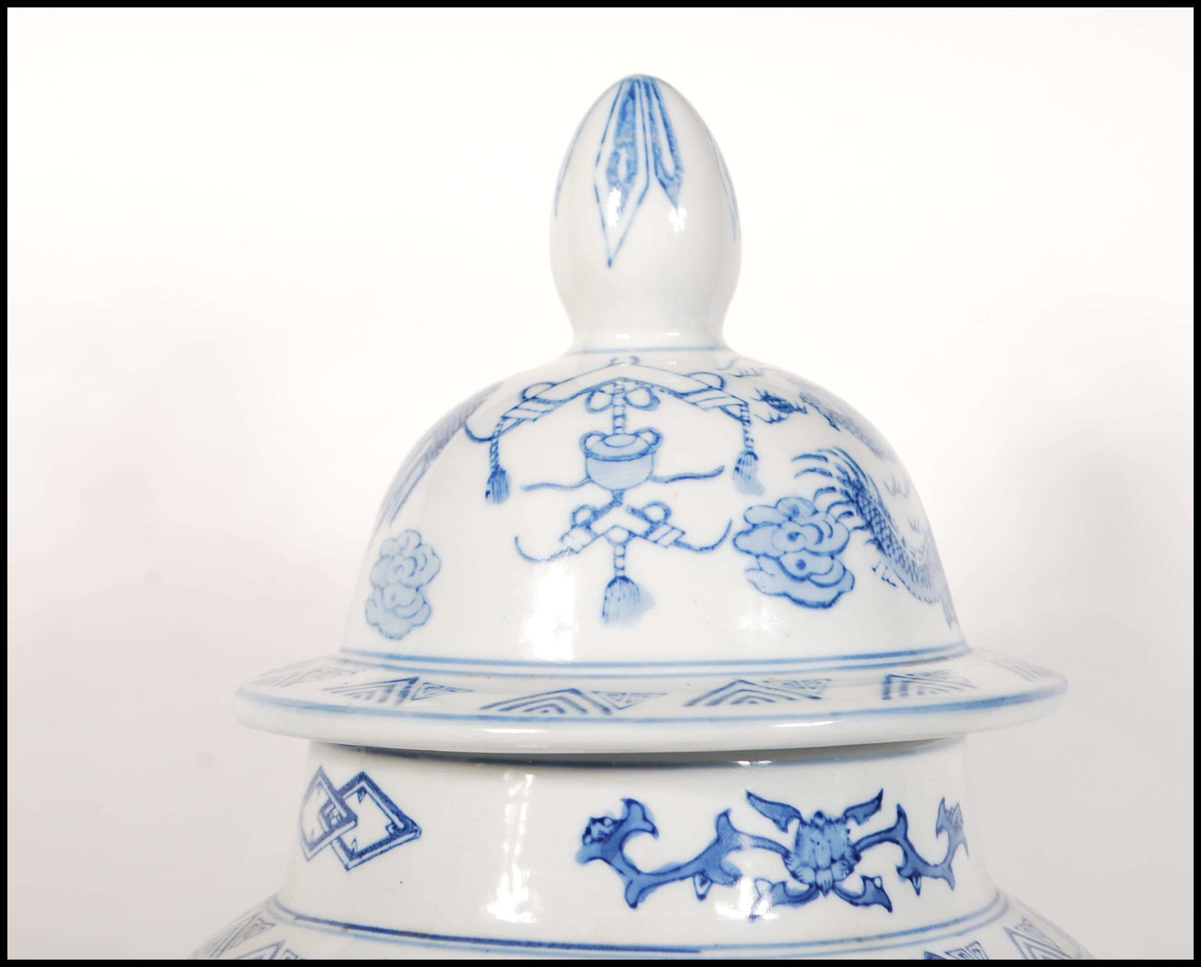 A tall 20th Century Chinese blue and white lidded - Image 6 of 9