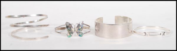 A group of four stamped 925 silver bangle bracelet