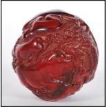 A 20th Century Chinese deep red resin sphere decor