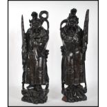 A pair of 20th century Chinese carved hardwood fig