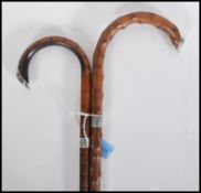 Two early 20th Century walking stick canes having