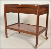 A retro 20th Century Danish teak wood two tiered b