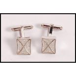 A pair of stamped 925 silver cufflinks having squa