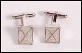 A pair of stamped 925 silver cufflinks having squa