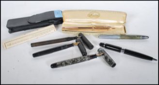 A collection of vintage writing pens to include a