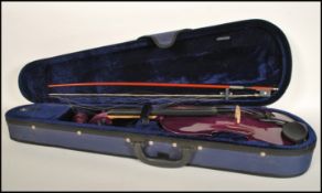 A 20th Century cased student violin, the hollow bo