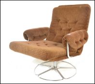 A mid century retro Danish influenced swivel easy