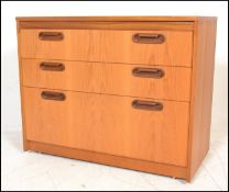 A retro 20th Century teak wood chest of drawers ha