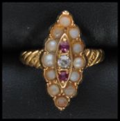 A 9ct gold seed pearl, ruby and diamond ring in lo