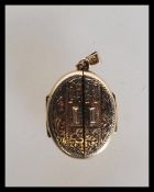 A 9ct gold hallmarked unusual double door locket b