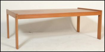 A retro mid 20th Century ash coffee table of simpl