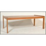 A retro mid 20th Century ash coffee table of simpl