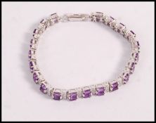 A stamped 925 silver bracelet set with oval cut am