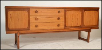 A retro mid 20th Century teak wood sideboard crede