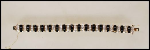 A stamped 925 gilt silver bracelet set with altern