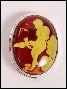 A stamped 925 silver cameo brooch having a glass p