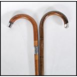 Two early 20th Century walking stick canes having