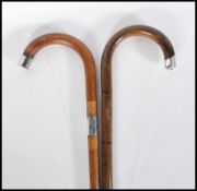 Two early 20th Century walking stick canes having