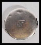 A silver hallmarked lroundel shaped ladies powder