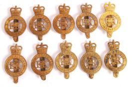 SET OF TEN HER MAJESTY'S PRISON BRASS CAP BADGES