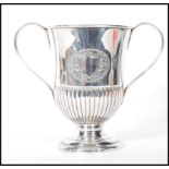 A good early 20th Century Sheffield plated twin handled trophy,the trophy raised on a stepped