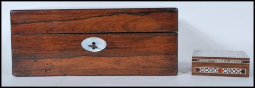 A 19th Century rosewood table top work box having inlaid mother of pearl panels to the lid and