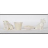 A collection of four Irish Belleek porcelain ceramics to include a Scottie Dog with green stamp to