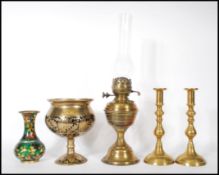 A collection of antique brass items to include a 19th Century Victorian oil lamp having its original