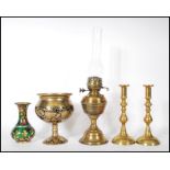 A collection of antique brass items to include a 19th Century Victorian oil lamp having its original