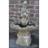 A 20th Century well weather reconstituted garden feature birdbath in the form of a clamshell with