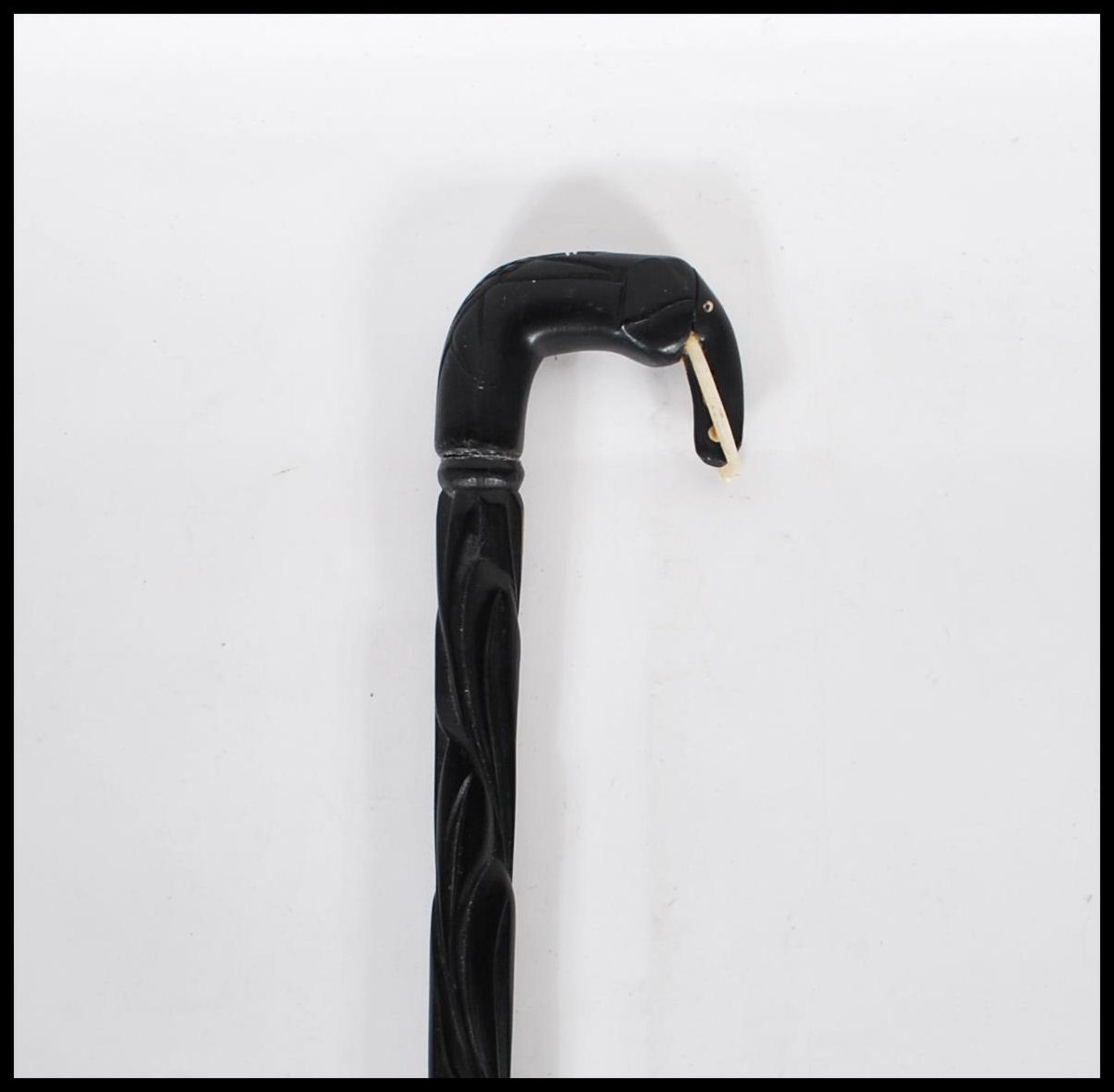 A vintage 20th Century ebony walking stick cane. T