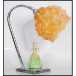 An early 20th Century 1930's Art Deco chrome table lamp light having a ceramic lady wearing a